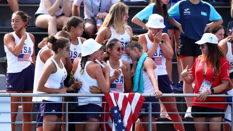 Members of the United States team react as Anita Alvarez is attended to by medical staff.