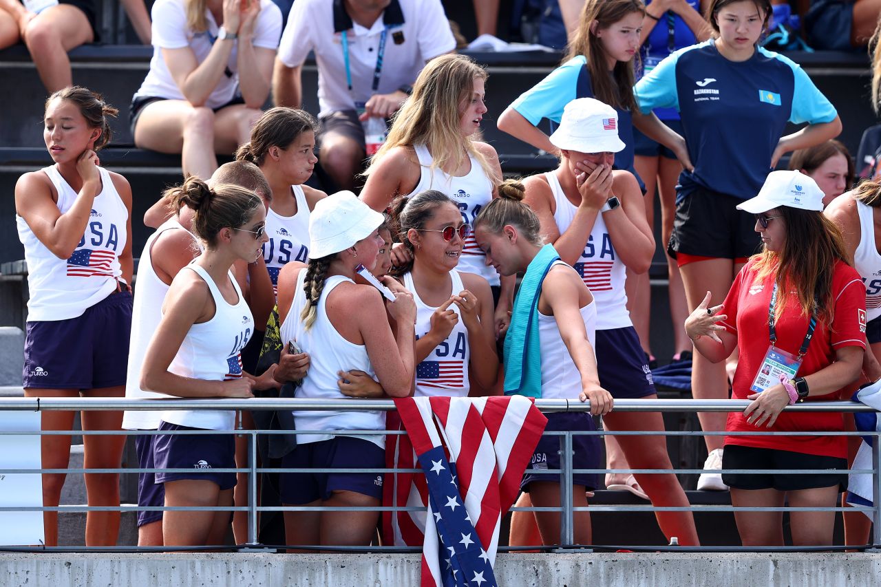 Members of Team United States react as Alvarez is attended to by medical staff.