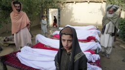 Men stand around the bodies of people killed in an earthquake in Gayan village, in Paktika province, Afghanistan, Thursday, June 23, 2022. A powerful earthquake struck a rugged, mountainous region of eastern Afghanistan early Wednesday, flattening stone and mud-brick homes in the country's deadliest quake in two decades, the state-run news agency reported. (AP Photo/Ebrahim Nooroozi)