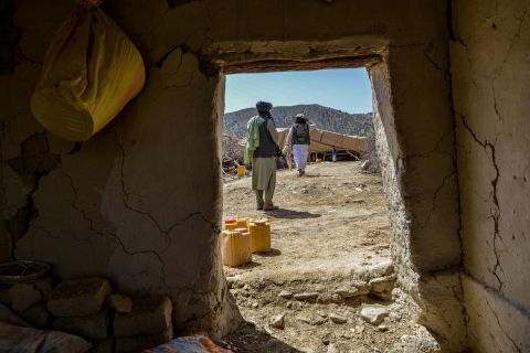 Afghan people set up tents as a temporary shelters amid the ruins of houses damaged in the earthquake in Paktika province, Afghanistan, on June 23.