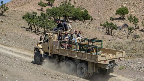 Members of a Taliban rescue team return from the affected villages after the earthquake.