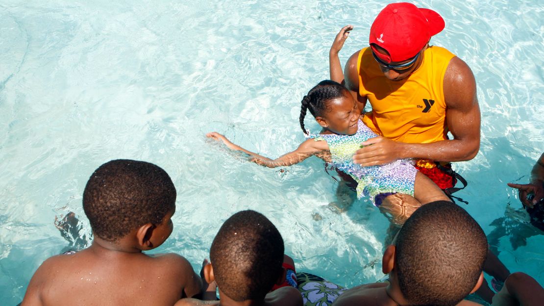 Children get a swimming lesson at a YMCA in Memphis, Tennessee.  Research shows participation in formal swimming lessons can reduce the risk of drowning. 