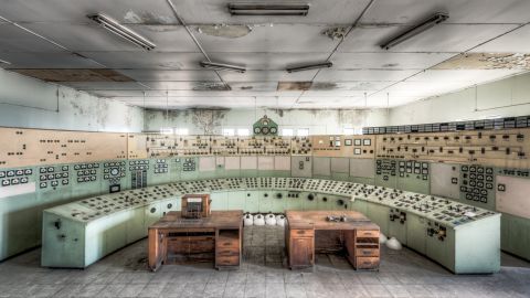 A broad view of the control panel and timber phone desks in the White Bay Power Station Control Room.