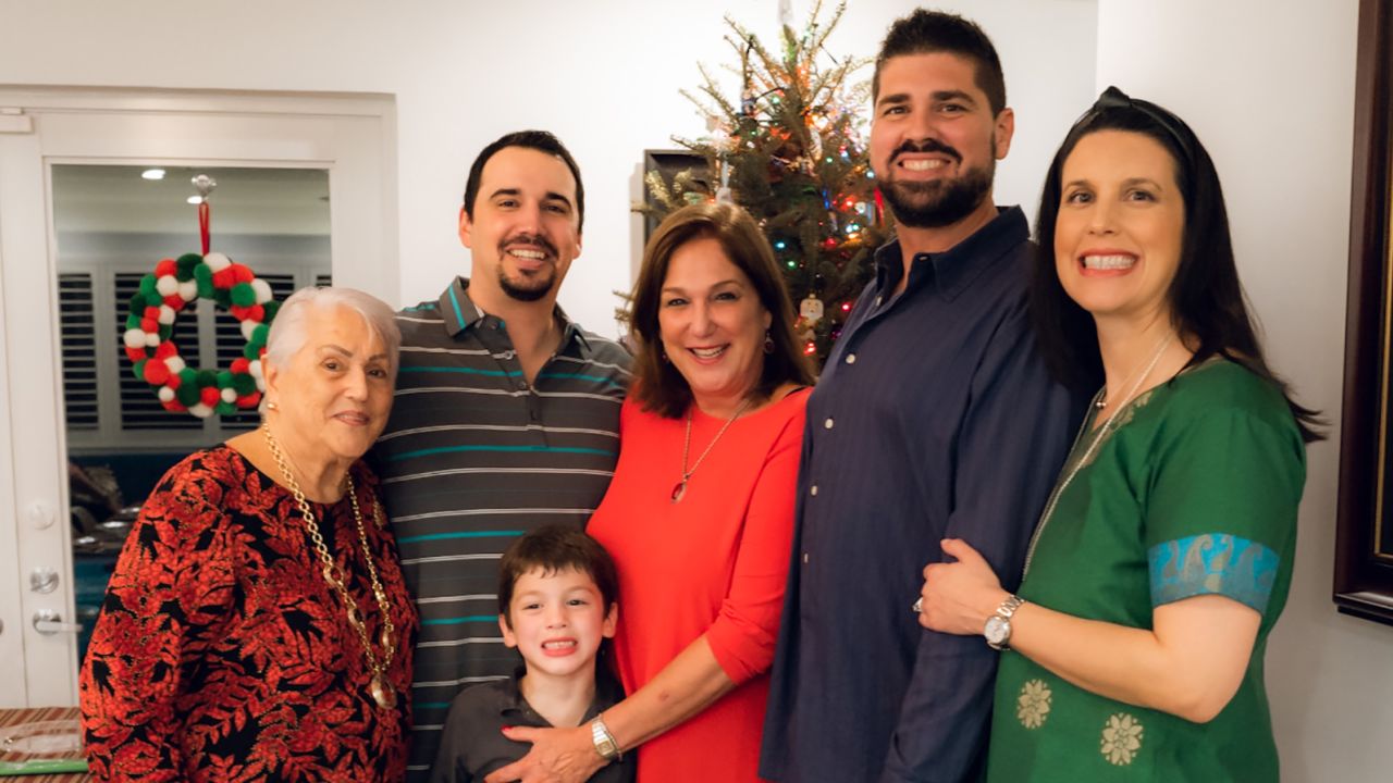 PJ Rodriguez and wife Vivian Lasaga, right, pose for a photo with Rodriguez's late grandmother Elena Chavez, brother Alex Rodriguez, son John Rodriguez and late mother Elena Chavez Blasser.