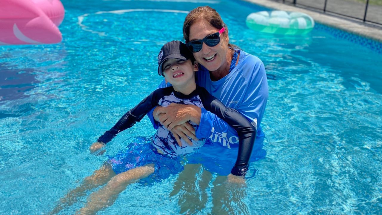 John Rodriguez, 7, has been learning to focus on the happy memories he made with his grandmother.