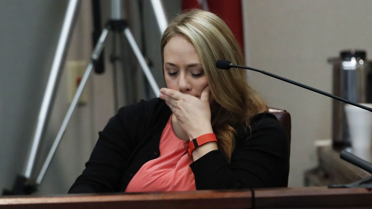 Leanna Taylor testifies at her ex-husband's murder trial. 