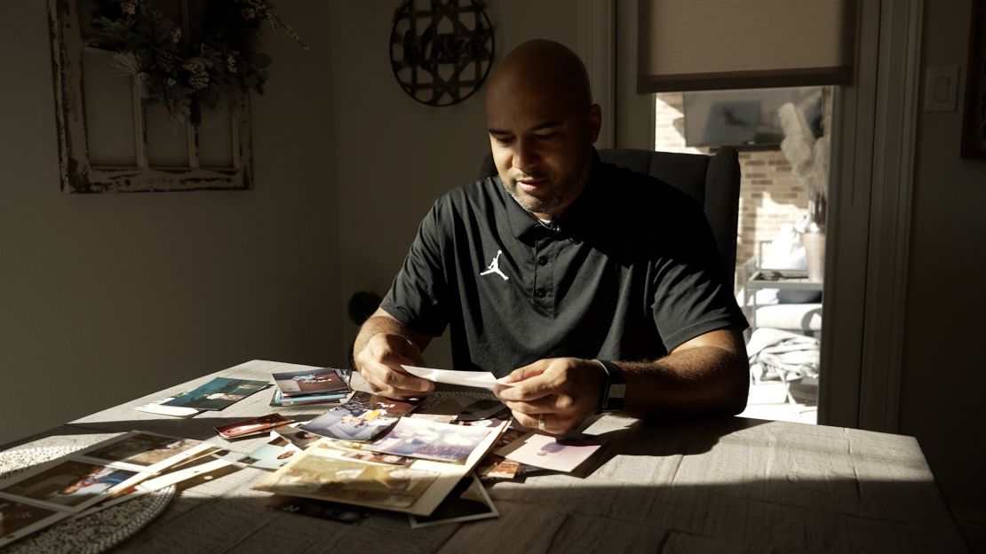 James Whitfield looks at photos at his home in Bedford, Texas on January 13, 2022.