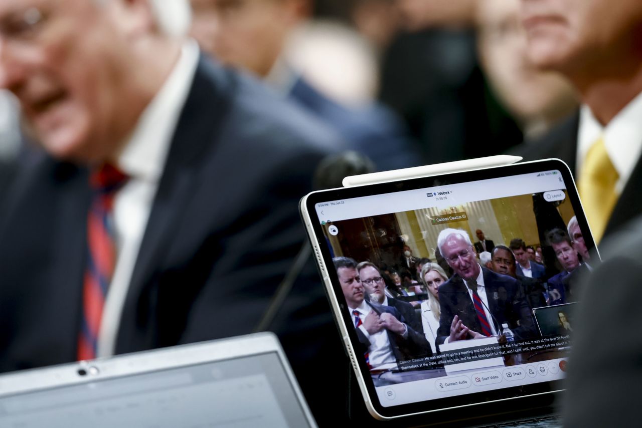 Rosen is displayed on a monitor while testifying on June 23.