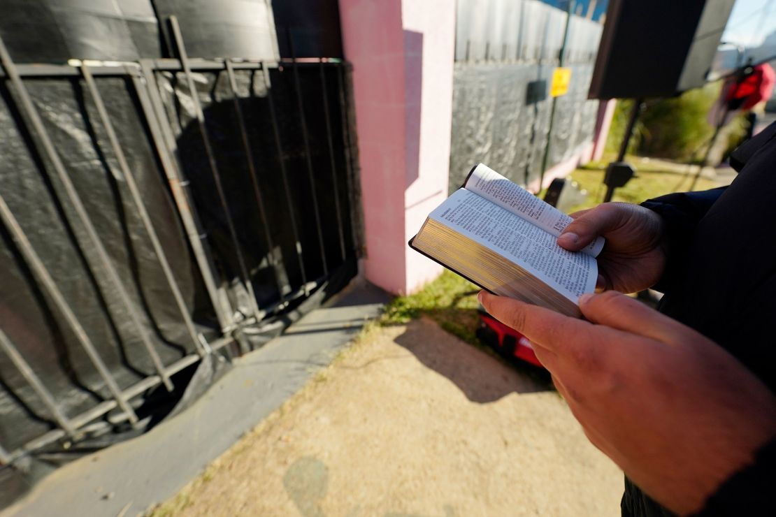 Gabriel Oliver, who opposes abortion rights,  reads from the Bible outside of an abortion clinic in Jackson, Mississippi, on December 1, 2021. 