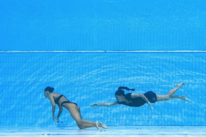 Swim coach Andrea Fuentes, right, <a href="https://www.cnn.com/2022/06/23/sport/anita-alvarez-swimmer-coach-spt-intl/index.html" target="_blank">rescues American swimmer Anita Alvarez</a> from the bottom of the pool after she lost consciousness during the finals at the FINA world Aquatic Championships in Budapest, Hungary, on Wednesday, June 22. Alvarez, who competed at the 2016 and 2020 Olympics, received medical attention beside the pool and was subsequently carried off on a stretcher. 