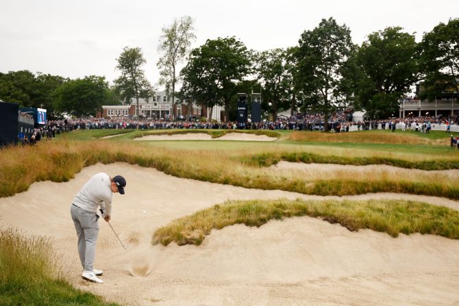 Matt Fitzpatrick of England plays a shot from a fairway bunker on the 18th hole during the final round of the US Open in Brookline, Massachusetts on Sunday, June 19. <a href="https://www.cnn.com/2022/06/19/golf/matt-fitzpatrick-us-open-golf-spt-intl/index.html" target="_blank">Fitzpatrick won his first career major</a> and became the first non-American to win both the US Amateur and US Open at the same venue. 