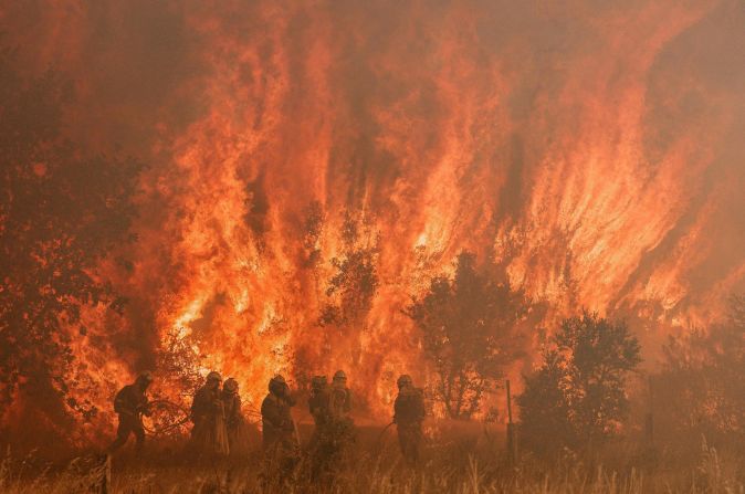 Firefighters battle a wildfire in Pumarejo de Tera, Spain on Saturday, June 18. This is just one of the multiple fires in Spain after an extreme heat wave hit the country.