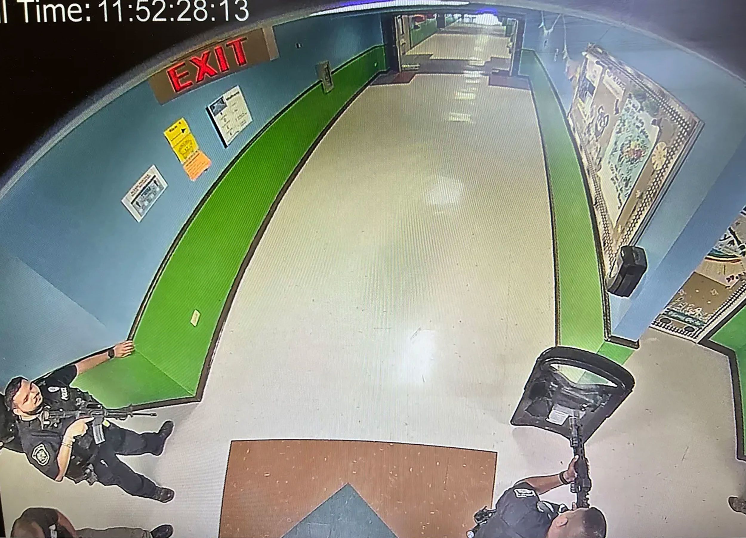 Officers are seen in the hallway of Robb Elementary School shortly after a gunman entered, resulting in the deaths of 19 children and two teachers.