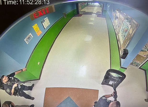 An image obtained by the Austin-American Statesman shows at least three officers in the hallway of Robb Elementary at 11:52 a.m, 19 minutes after a gunman entered the school, killing 19 children and two teachers. One officer has what appears to be a tactical shield, and two of the officers hold rifles. The Uvalde mayor has criticized the current investigations and <a href="https://www.cnn.com/2022/06/21/us/uvalde-texas-school-shooting-footage-police-response/index.html" target="_blank">claims the elementary school will be demolished.</a>
