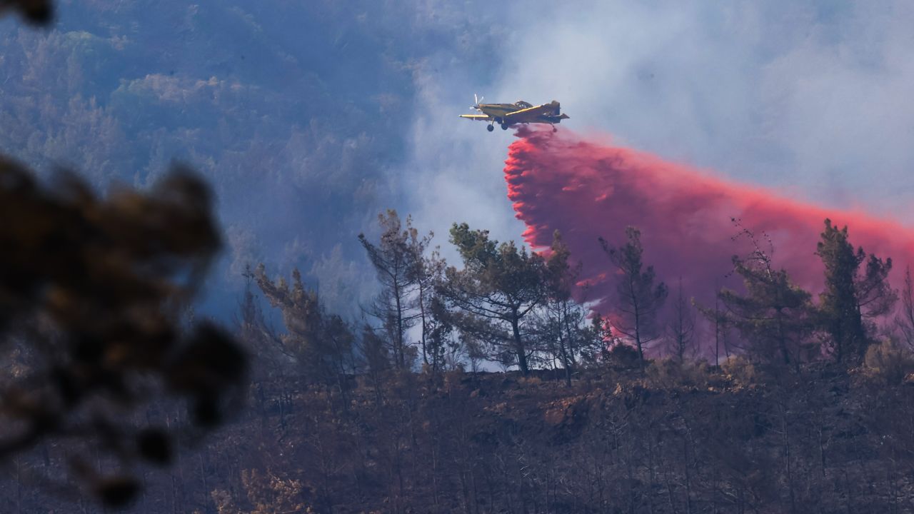  A plane responding to a wildfire in the Marmaris district of southern Turkey on June 23, 2022. 