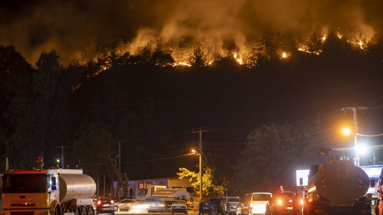 Smoke and flames rise as firefighters battle a blaze by air and land in Marmaris, Turkey, on June 23, 2022.