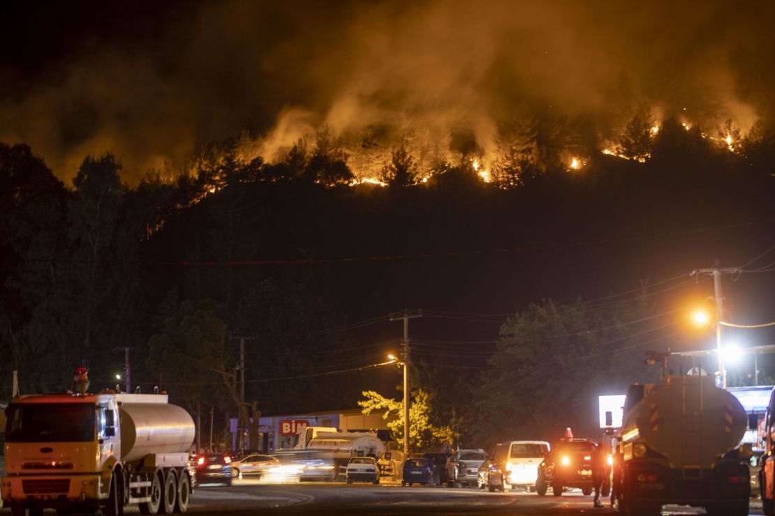 Smoke and flames rise as firefighters battle a blaze by air and land in Marmaris, Turkey, on June 23, 2022.