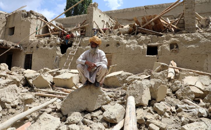 A man sits on the debris of a building after an <a href="index.php?page=&url=https%3A%2F%2Fedition.cnn.com%2F2022%2F06%2F22%2Fasia%2Fafghanistan-earthquake-aid-rescue-search-intl-hnk%2Findex.html" target="_blank">earthquake in Paktika</a>, Afghanistan on June 22. The magnitude 5.9 quake struck during the early hours of Wednesday near the city of Khost and the death toll has risen to over 1000 people.