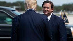 US President Donald Trump is greeted by Florida Governor Ron DeSantis at Southwest Florida International Airport October 16, 2020, in Fort Myers, Florida. (Photo by Brendan Smialowski / AFP) (Photo by BRENDAN SMIALOWSKI/AFP via Getty Images)