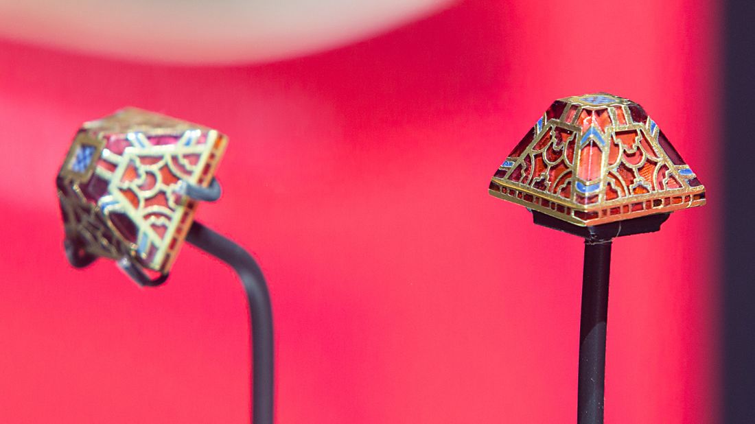 This pair of gold and garnet sword pyramid fittings were the first items of gold discovered during the 1939 Sutton Hoo excavations. The sword pyramids likely attached a leather strap that secured a sword in a scabbard to a belt and kept the sword in its sheath. 