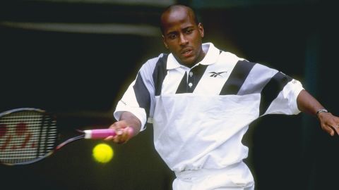 Mal Washington in action during Wimbledon at the All England Club in London.