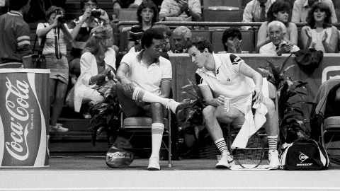 US Captain Ashe and player John McEnroe during the 1984 Davis Cup in Atlanta, Georgia.