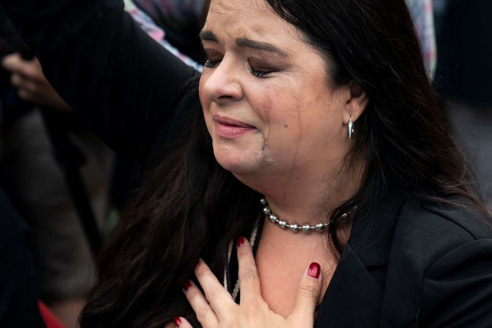 An anti-abortion demonstrator reacts to the ruling on Friday in Washington, DC.