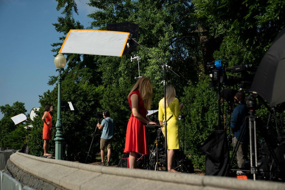 Journalists cover the Supreme Court decision on Friday in Washington, DC.