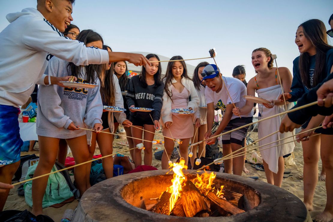 Teenagers attend a birthday party at a California beach this week.