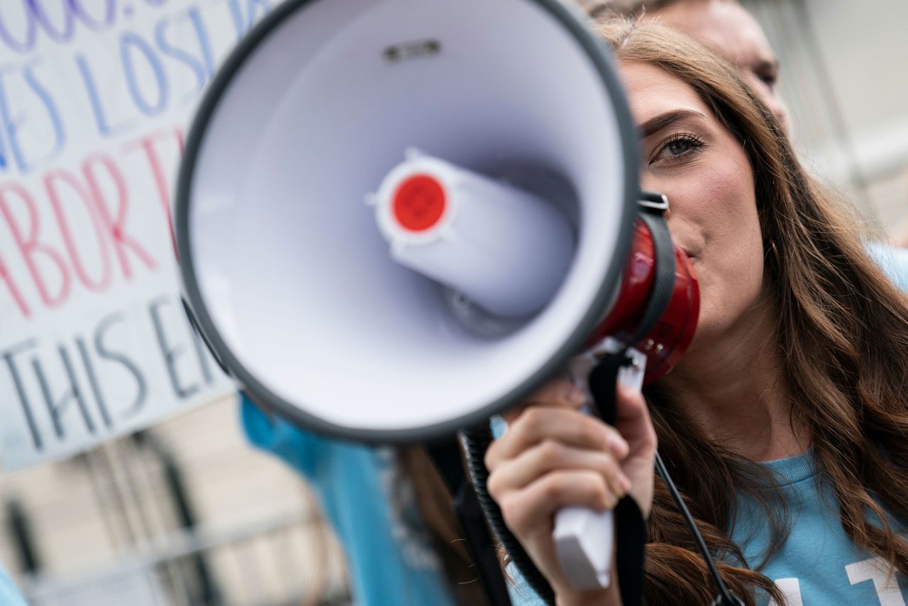 A demonstrator shouts anti-abortion slogans through a megaphone outside the Supreme Court on Friday.