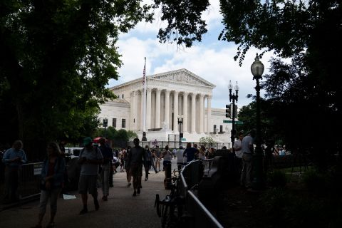 People gather in front of the Supreme Court after it overturned Roe v. Wade on Friday.