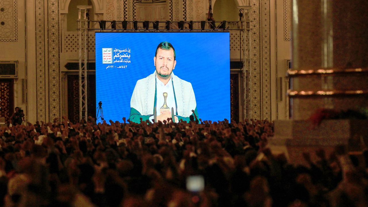 Supporters of Yemen's Houthi movement listen to a speech by their leader Abdel Malek al-Houthi, transmitted via a giant screen inside a mosque in the capital Sanaa on June 22.