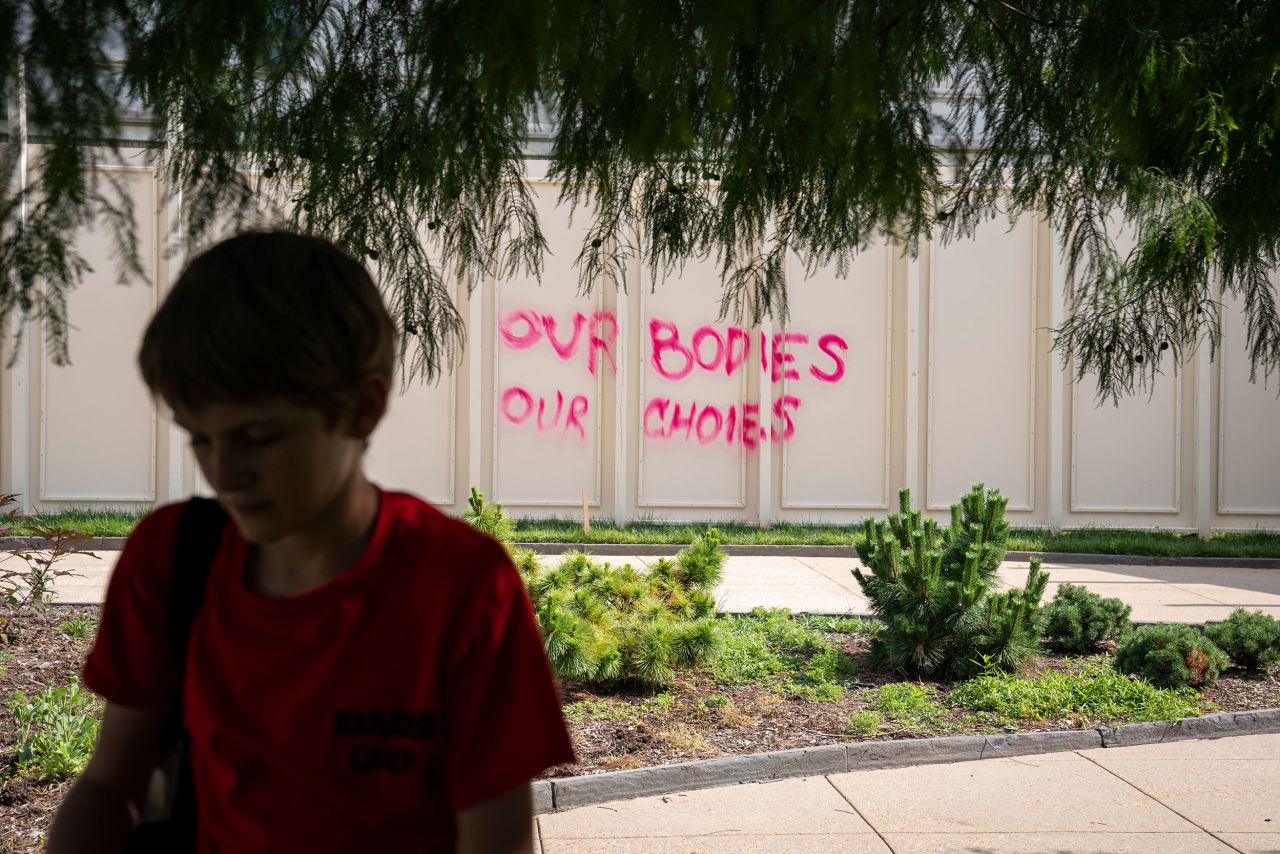 "Our bodies our choices" is spray-painted on a temporary wall in Washington, DC, on Friday.