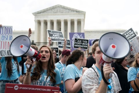 Noah Slayter, right, demonstrates with fellow anti-abortion activists in front of the Supreme Court on Friday. 
