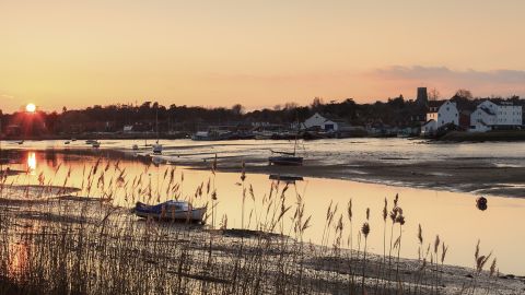 The wooden ship had been dragged half a mile from the River Deben, shown here at low tide, before being buried inside a mound.