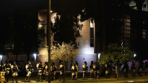Riot police surround the Arizona Capitol after protesters reached the front of the Arizona Senate building following the Supreme Court's decision to overturn Roe v. Wade on Friday.