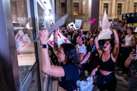 Abortion rights activists pound on the doors of the Arizona State Senate late Friday, June 24. <a href="https://www.cnn.com/2022/06/24/us/supreme-court-roe-v-wade-protests/index.html" target="_blank">Law enforcement used tear gas</a> to disperse the crowd.