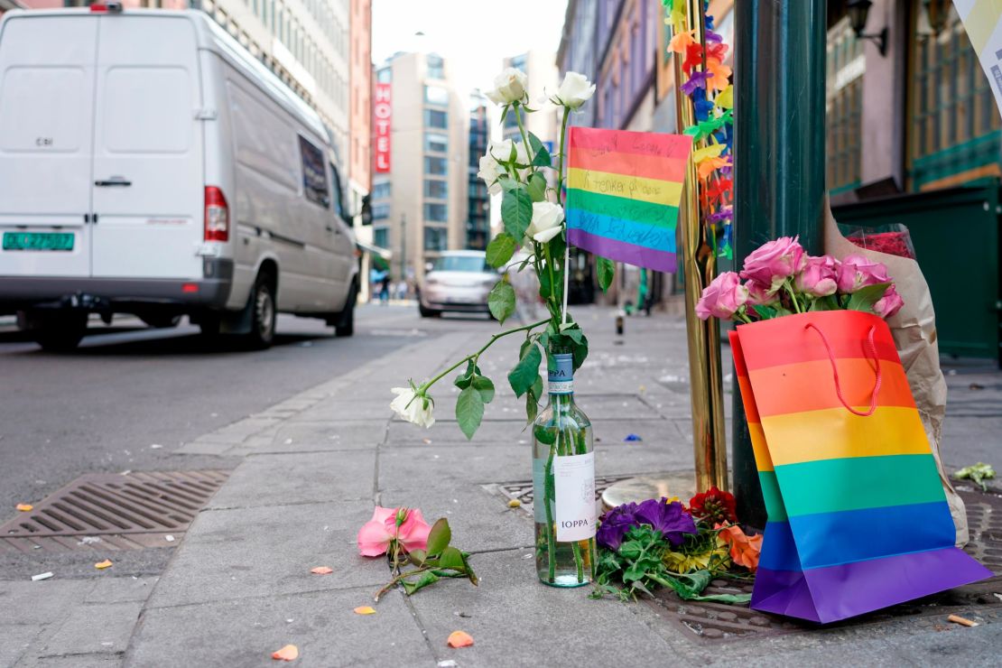 Flowers are left at the scene of the shooting in central Oslo.