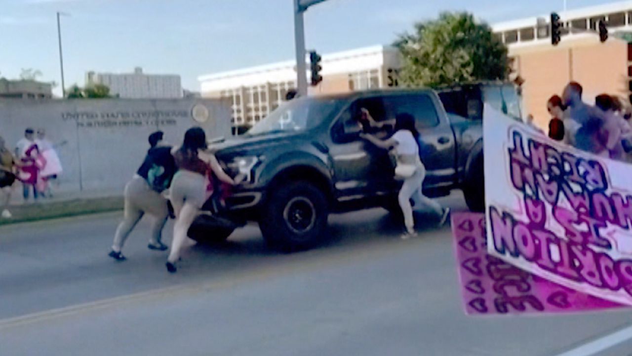 Truck hits protesters Iowa