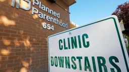 FILE - In this Aug. 21, 2019, file photo, a sign is displayed at Planned Parenthood of Utah in Salt Lake City. An appeals court is considering whether to block a Trump administration rule that bans taxpayer-funded health clinics from referring patients for an abortion, a rule that has already prompted many providers, including Planned Parenthood, to leave a longstanding federal family planning program. Eleven judges from the 9th U.S. Circuit Court of Appeals in San Francisco heard arguments Monday, Sept. 23, 2019, in challenges brought by 22 states as well as Planned Parenthood and other organizations. (AP Photo/Rick Bowmer, File)