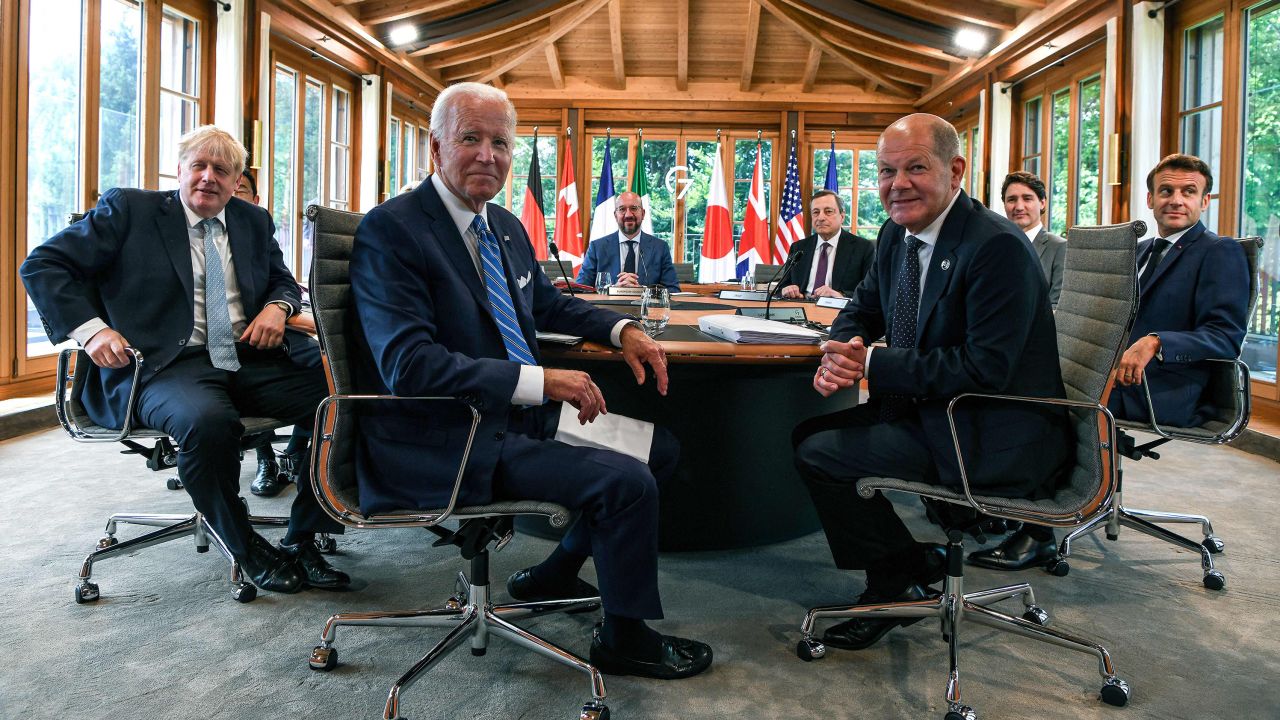Britain's Prime Minister Boris Johnson, US President Joe Biden, European Council President Charles Michel, Italy's Prime Minister Mario Draghi, Germany's Chancellor Olaf Scholz, Canada's Prime Minister Justin Trudeau and France's President Emmanuel Macron attend a working lunch to discuss shaping the global economy at the Yoga Pavilion during the G7 Summit held at Elmau Castle, southern Germany on June 26, 2022.