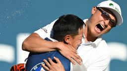 MUNICH, GERMANY - JUNE 26: Haotong Li of China celebrates with their caddie on the 18th hole following the playoff during Day Four of the BMW International Open at Golfclub Munchen Eichenried on June 26, 2022 in Munich, Germany. (Photo by Stuart Franklin/Getty Images)