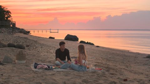 Ilan Luttway (left) is shown with a love interest in a scene from "Forever Summer: Hamptons." 