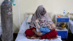 Shah Mireh, 40, from the quake-hit area of Barmal, holds her baby inside a hospital ward after the baby was injured in a recent earthquake, in Sharana, Afghanistan, June 24, 2022.