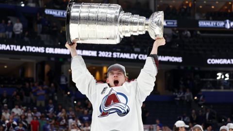 TAMPA, FLORIDA - JUNE 26: Bowen Byram #4 of the Colorado Avalanche lifts the Stanley Cup after defeating the Tampa Bay Lightning 2-1 in Game Six of the 2022 NHL Stanley Cup Final at Amalie Arena on June 26, 2022 in Tampa, Florida. (Photo by Christian Petersen/Getty Images)