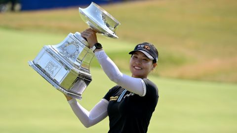 Chun In-gee hoists the trophy after winning the KPMG Women's PGA Championship at Congressional Country Club.