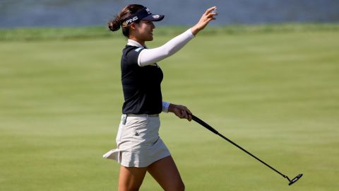 Chun celebrates making her putt for par on the 18th green to win.