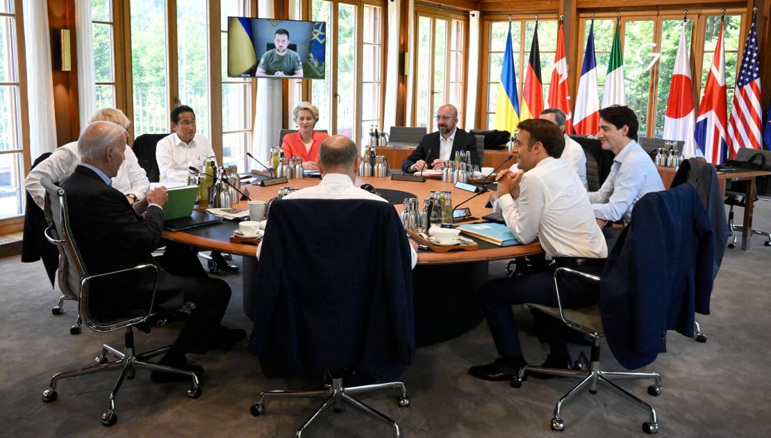 Germany's Chancellor Olaf Scholz, US President Joe Biden, Britain's Prime Minister Boris Johnson, Japan's Prime Minister Fumio Kishida, European Commission President Ursula von der Leyen, European Council President Charles Michel, Italy's Prime Minister Mario Draghi, Canada's Prime Minister Justin Trudeau and France's President Emmanuel Macron have taken seats at a round table as Ukraine's President Volodymyr Zelensky addresses G7 leaders via video link during their working session on Monday, June 27, 2022, at Elmau Castle, southern Germany.