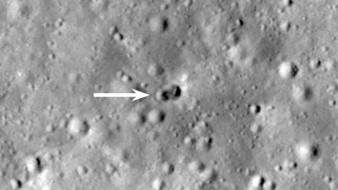 A rocket body hit the moon on March 4, creating a double crater, as indicated by the white arrow.