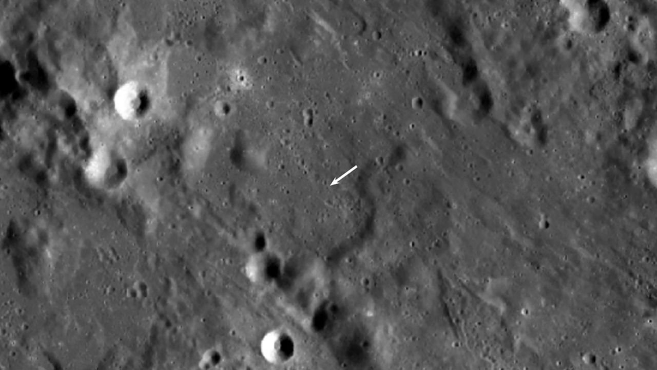 The new crater is smaller than others and not visible in this view, but its location is indicated by the white arrow. 
